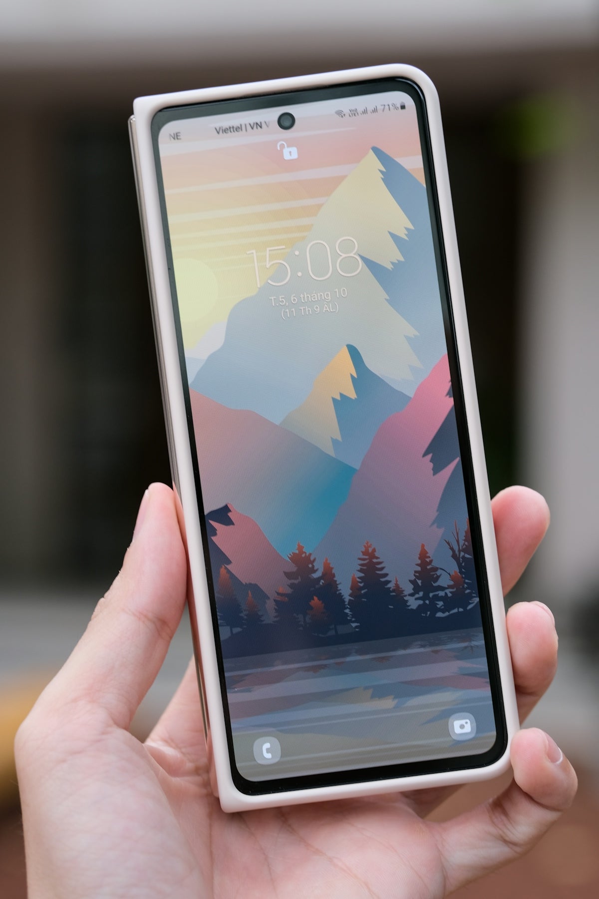 a hand holding a phone